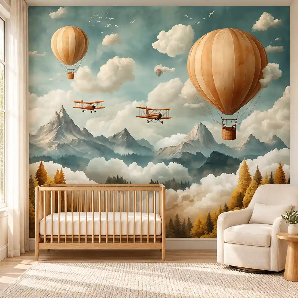 Baby nursery with wooden crib and glider under a hot air balloon wall mural