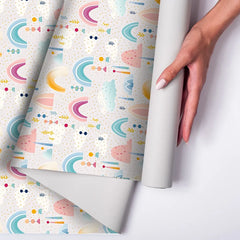 Beautiful pastel rainbow and cloud kids room nursery wallpaper adds harmony.