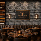 Full panel of charcoal timber wall wallpaper across a wide feature wall.