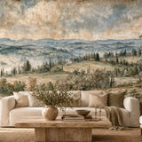 Cream sofa styled under a painterly Italian countryside landscape mural
