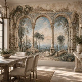 Dining room with linen chairs and a Mediterranean arches landscape wall mural
