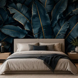 Midnight blue tropics wallpaper close-up showing bold leaf silhouettes and navy tones