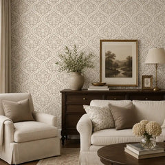 Peel-and-stick damask wallpaper sample showing cream and gold pattern detail