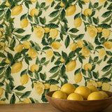 Sunlit lemon removable wallpaper sample tile, yellow and green citrus pattern detail
