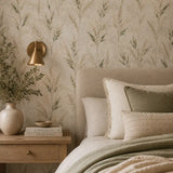 Restful bedroom with wild meadow leaves wallpaper creating a green natural backdrop