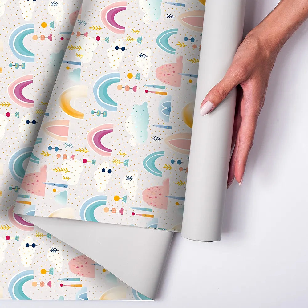 Beautiful pastel rainbow and cloud kids room nursery wallpaper adds harmony.