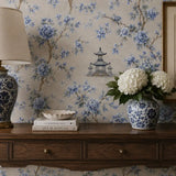 Texture close up of blue chinoiserie garden wallpaper with a matte finish.