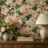 Full panel repeat of blush garden rose wallpaper across a feature wall.