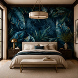 Midnight tropical wallpaper above a bed in a dark luxe bedroom with drum pendant