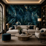 Deep blue tropical wallpaper accent wall behind a cream sofa and round coffee table