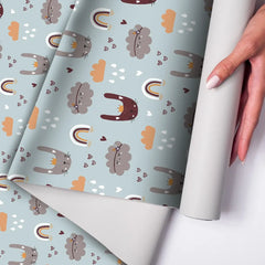 Dreamy bunny and rainbow kids room nursery wallpaper creates a soft atmosphere.