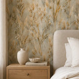 Warm bedroom nightstand corner accented by golden wild meadow wallpaper