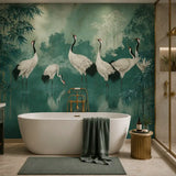 Crane sanctuary mural in a green spa bathroom with freestanding tub and brass stool