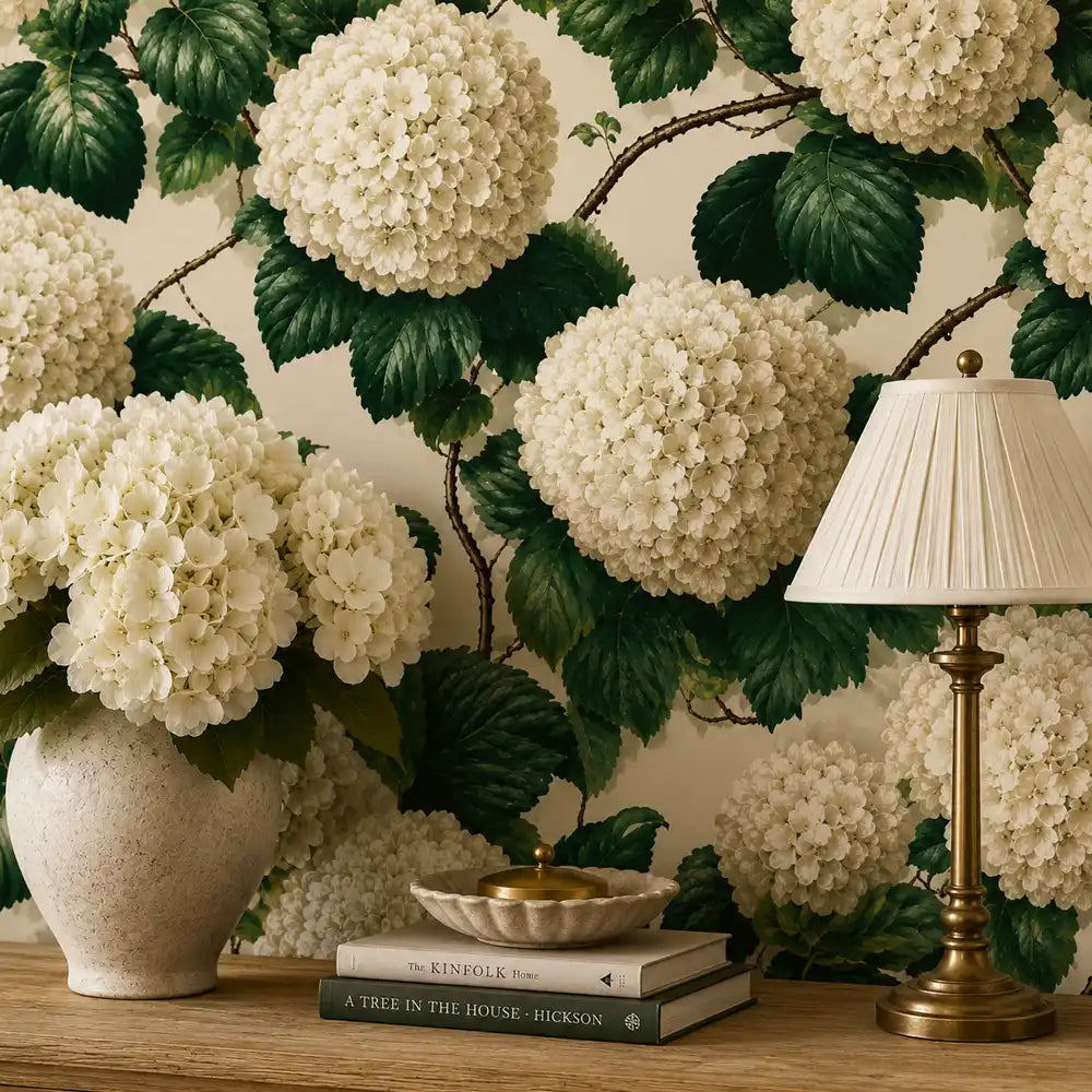 Ivory hydrangea wallpaper styled behind a decorative shelf with vases and books