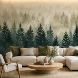 Pine forest mural wallpaper behind a cream sectional and round wood coffee table