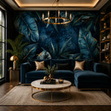 Midnight tropical luxe wallpaper in a navy velvet living room with gold chandelier