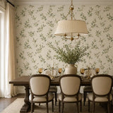 Full panel of olive branch watercolor wallpaper on a tall interior wall.