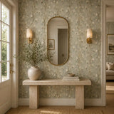 Entryway with an oval mirror and console table set against soft meadow grass wallpaper