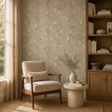 Quiet armchair nook framed by soft meadow grass wallpaper for relaxing reading