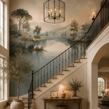 Landscape lake mural wallpaper on a double-height staircase wall with iron railing