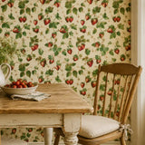 Removable botanical wallpaper with strawberry motif, installed in dining area
